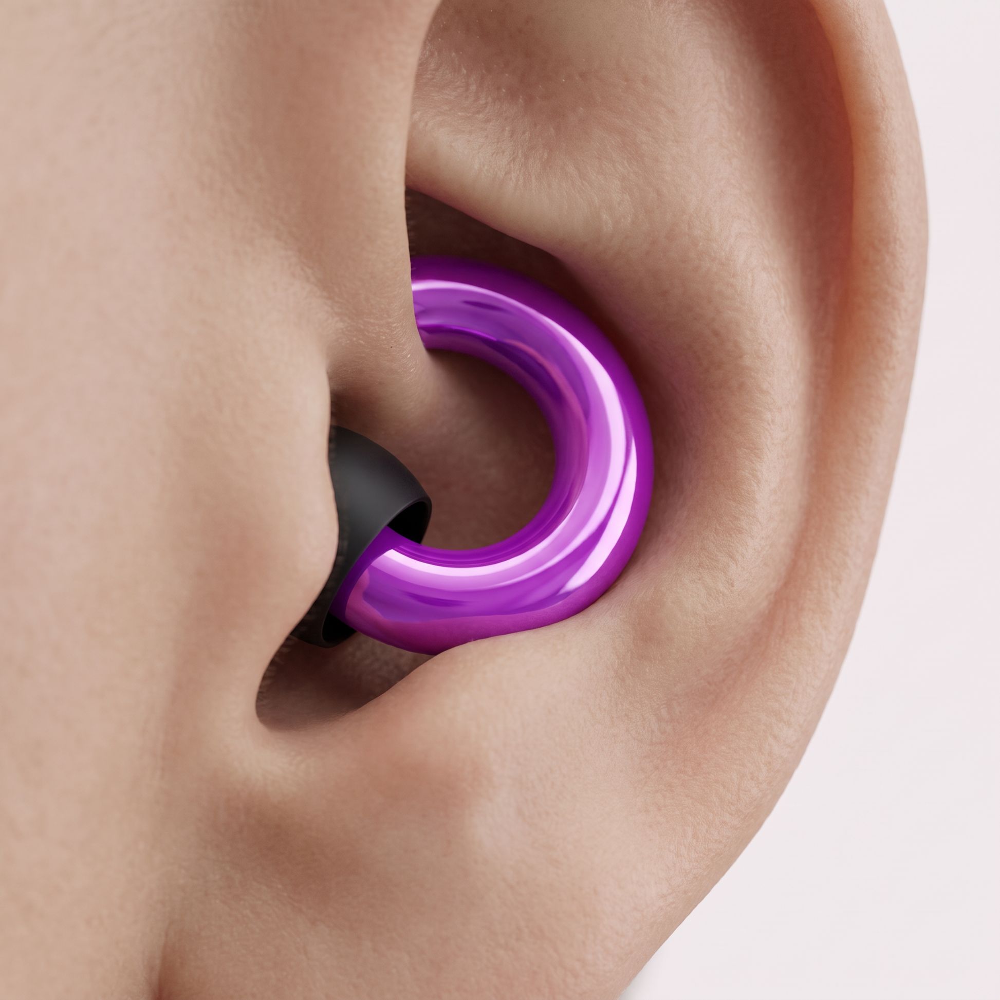 A Silent Rest earplug worn in the ear, sitting flush